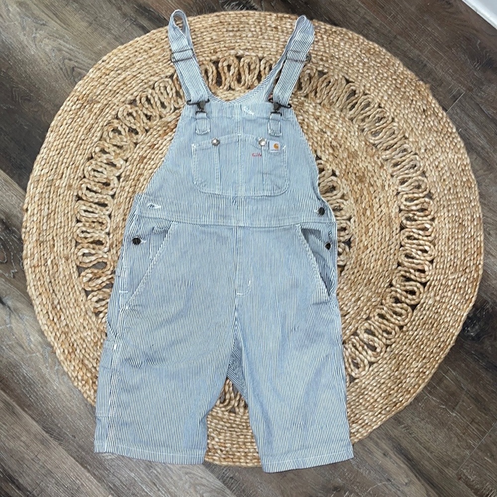 CARHARTT RUGGED FLEX. RELAXED FIT DENIM RAILROAD STRIPE BIB OVERALL SHORTS.